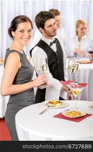 Catering service at business meeting offer champagne aperitif to woman