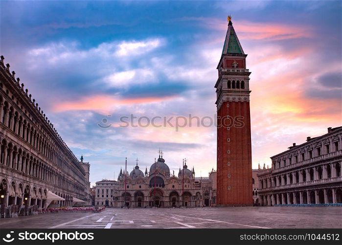Cathedral Basilica and Campanile of Saint Mark viewed from Piazza San Marco at sunrise, Venice, Italy.. San Marco square at sunrise. Venice, Italy