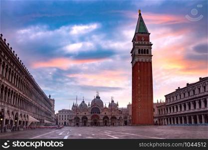 Cathedral Basilica and Campanile of Saint Mark viewed from Piazza San Marco at sunrise, Venice, Italy.. San Marco square at sunrise. Venice, Italy