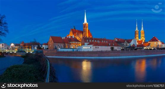Cathedral Island at night in Wroclaw, Poland. Panorama of Cathedral Island or Ostrow Tumski with Cathedral of St. John and church of the Holy Cross and St. Bartholomew at night in Wroclaw, Poland