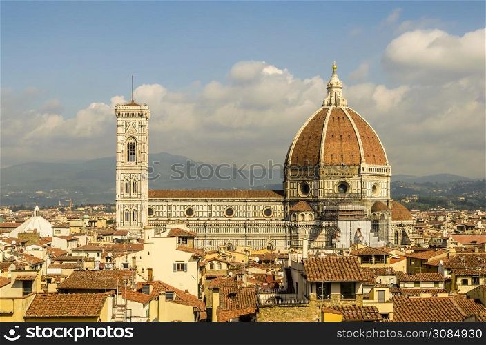 cathedral of florence and its dome of one hundred fourteen meters of height and background the mountains of tuscany