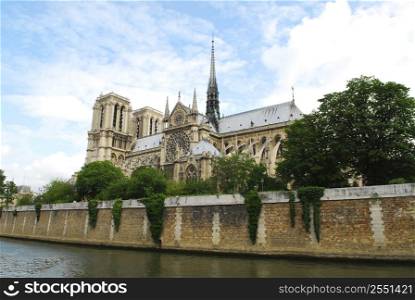 Cathedral of Notre Dame de Paris - side view with rose window. Paris, France.