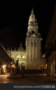 Cathedral of Santiago of Compostela seen from Silversmith Square at night. Plaza de Platerias with Cathedral Clock Tower and Fountain of the Horses view