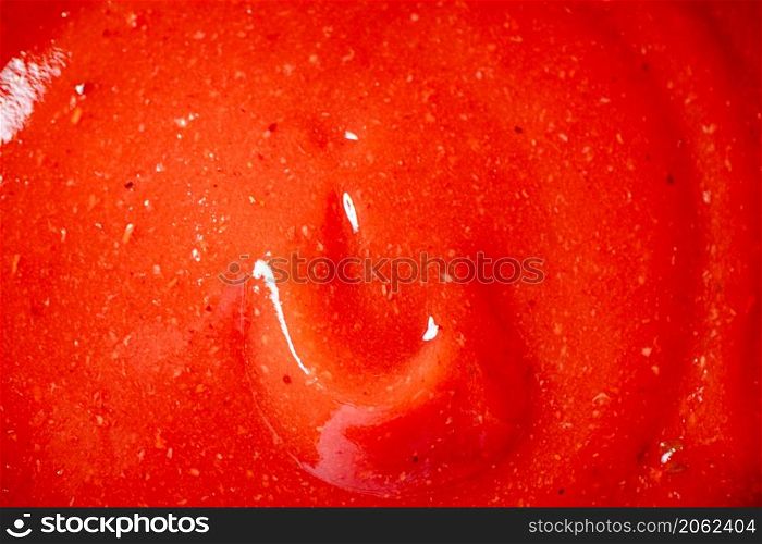 Catsup. Macro background. The texture of tomato sauce. High quality photo. Catsup. Macro background. The texture of tomato sauce.