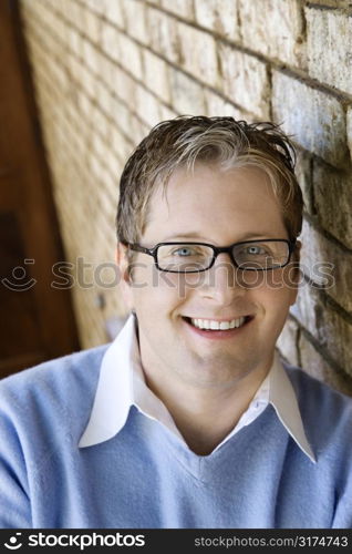 Caucasian adult male wearing glasses and smiling.
