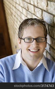 Caucasian adult male wearing glasses and smiling.