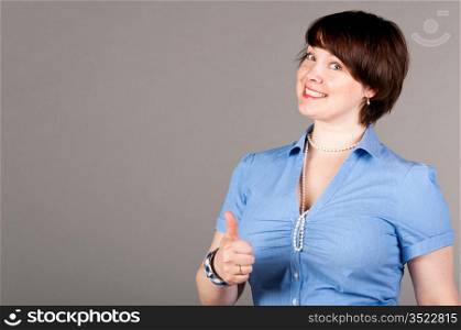 caucasian business woman is showing thumb up