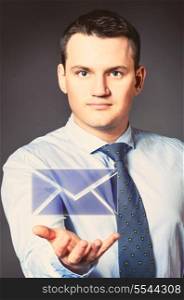 caucasian businessman is holding message in hands. business man with icon
