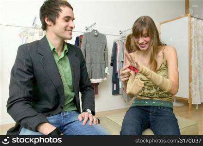 Caucasian Couple Flirting In A Fashionable Boutique