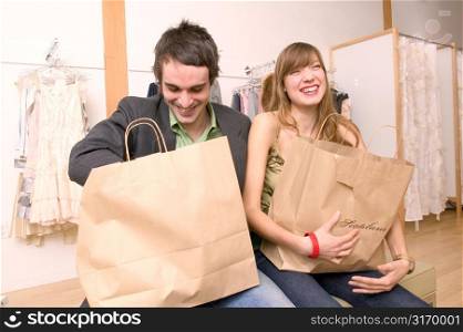 Caucasian Couple Happy With Their Purchases At A Trendy Boutique