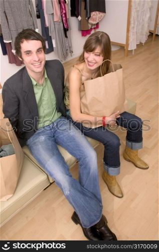Caucasian Couple Happy With Their Purchases At A Trendy Boutique