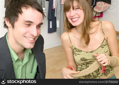 Caucasian Couple Sitting In A Retail Shop And Laughing