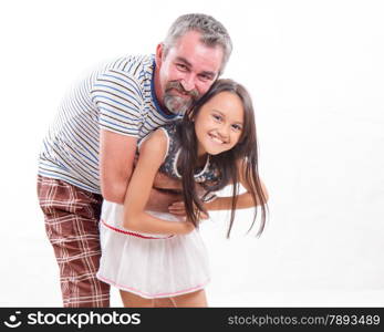 Caucasian father holding mixed race daughter, happy and smiling