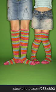 Caucasian female children wearing striped socks.