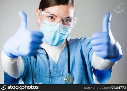 Caucasian female doctor showing two thumbs up,medical professional woman giving both thumbs up gesture,positive case development,successful patient recovery after treatment,overcoming disease illness