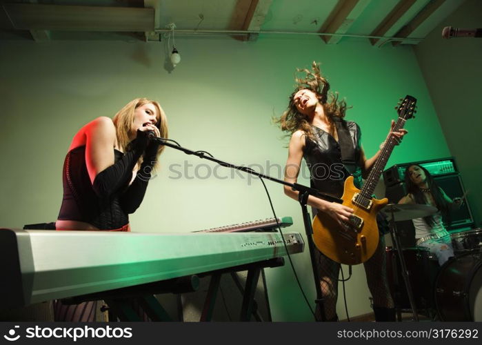 Caucasian girl band playing instruments.