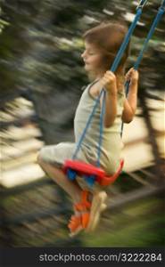 Caucasian Girl On A Swing
