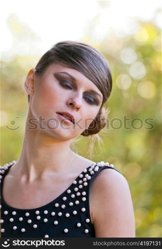 Caucasian girl portrait with makeup in natural light