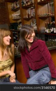 Caucasian Girlfriends Laughing In A Bar