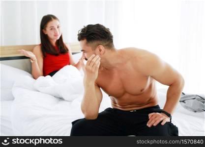 Caucasian lover Couple on the bed unhappy in having sex and have problems in relationship of married life. Erectile Dysfunction concept.