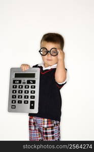 Caucasian male child wearing glasses and holding large calculator.