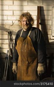 Caucasian male metalsmith portrait.