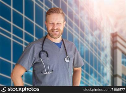 Caucasian Male Nurse In Front Of Hospital Building.