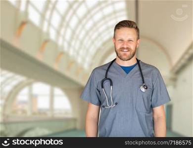 Caucasian Male Nurse Inside Hospital Building.