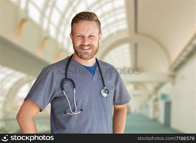 Caucasian Male Nurse Inside Hospital Building.