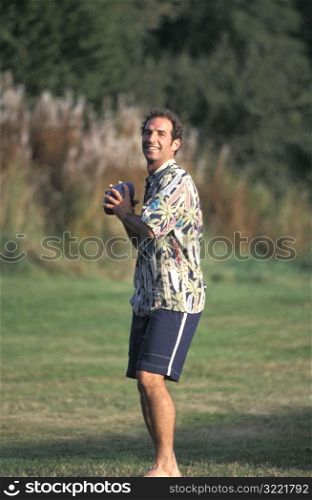 Caucasian Man Holding A Football In The Park