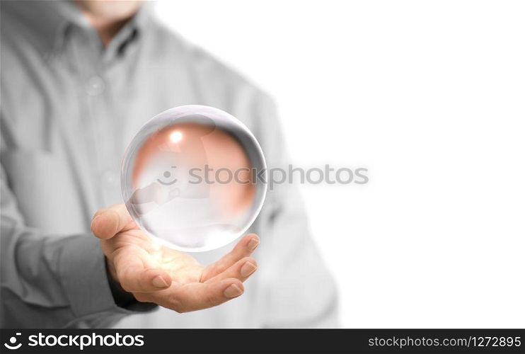 Caucasian man holding a glass or crystal ball, copy space on the left side of the image. Magician or fortuneteller background concept over white.. Crystal Ball
