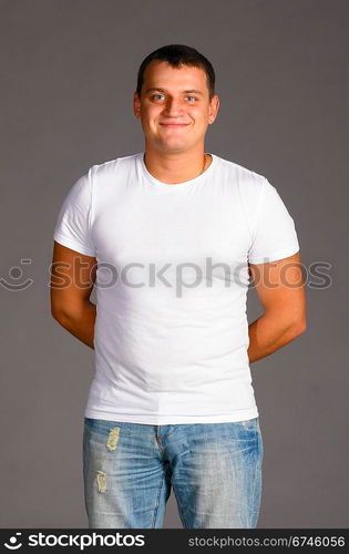 caucasian man in casual clothes on gray background