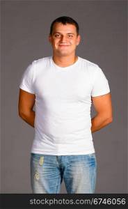 caucasian man in casual clothes on gray background