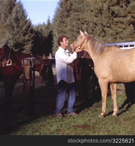 Caucasian Man Talking With A Horse On A Ranch