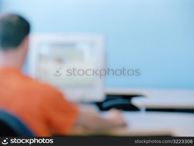 Caucasian Man Using A Desktop Computer In A Classroom