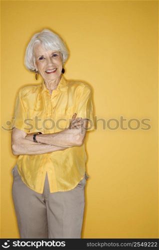 Caucasian mature adult female standing smiling.