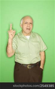 Caucasian mature adult male holding up one finger.