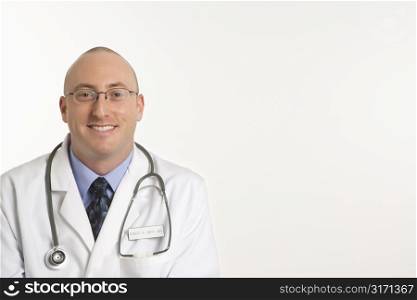 Caucasian mid adult male physician smiling.