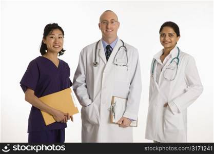 Caucasian mid adult male physician with Asian and Indian women doctors.