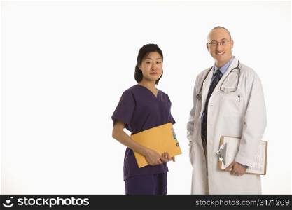 Caucasian mid adult male physician with Asian woman doctor.