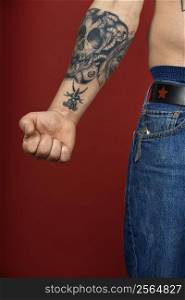 Caucasian mid-adult man&acute;s arm with tattoo.