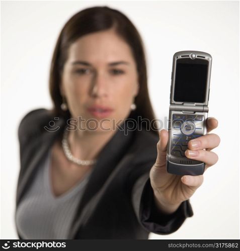 Caucasian mid adult professional business woman taking picture of self with camera phone.