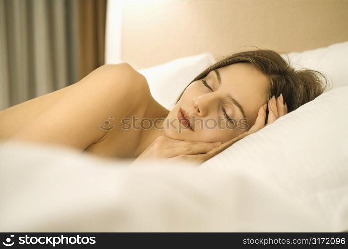 Caucasian mid-adult woman sleeping.