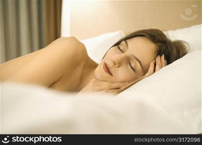 Caucasian mid-adult woman sleeping.
