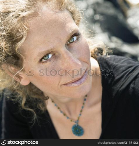 Caucasian mid-adult woman with wavy hair looking at viewer.