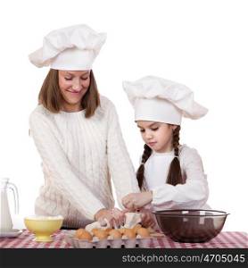 Caucasian mother and daughter preparing dough and having fun, isolated on white background