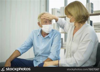 Caucasian senior couple wearing a mask, covid19 pandemic concept