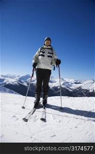 Caucasian senior man skier on slopes.