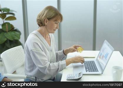 Caucasian senior people holding credit card, shopping online concept