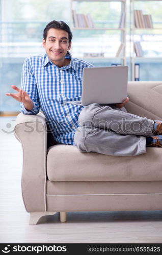 Caucasian student with laptop preparing for university exams. Caucasian student with laptop preparing for university exams